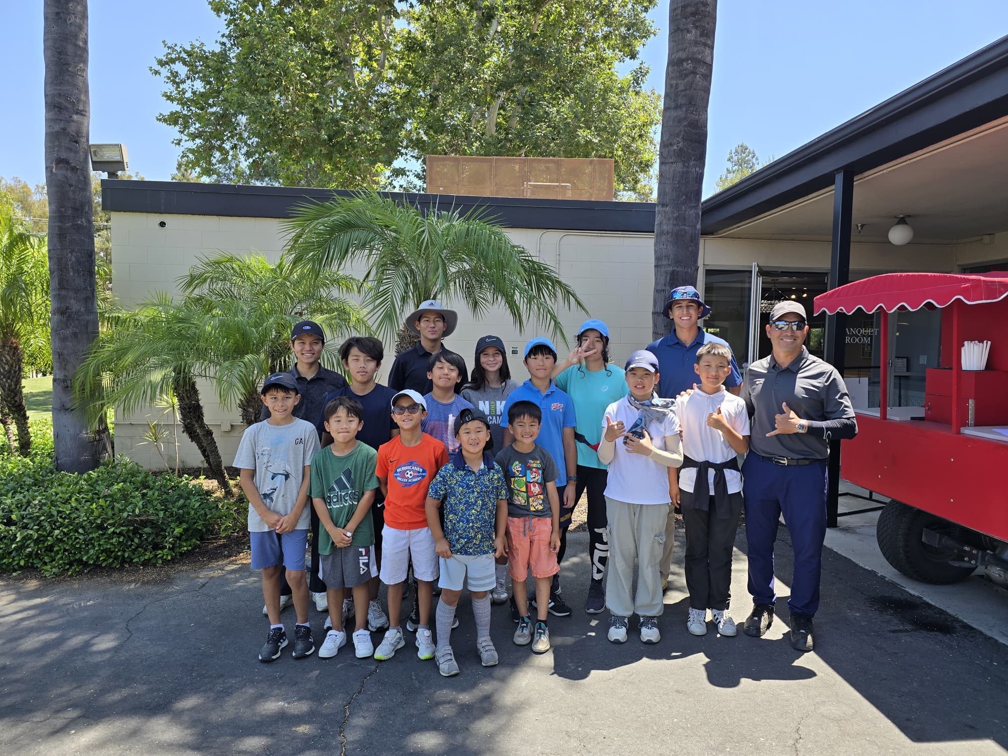 Jucchou Golf Nike Junior Golf Camp group with their coaches at the course
